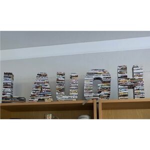 3D paper sculpted LAUGH   (Colorful Recycled Magazine Letters)